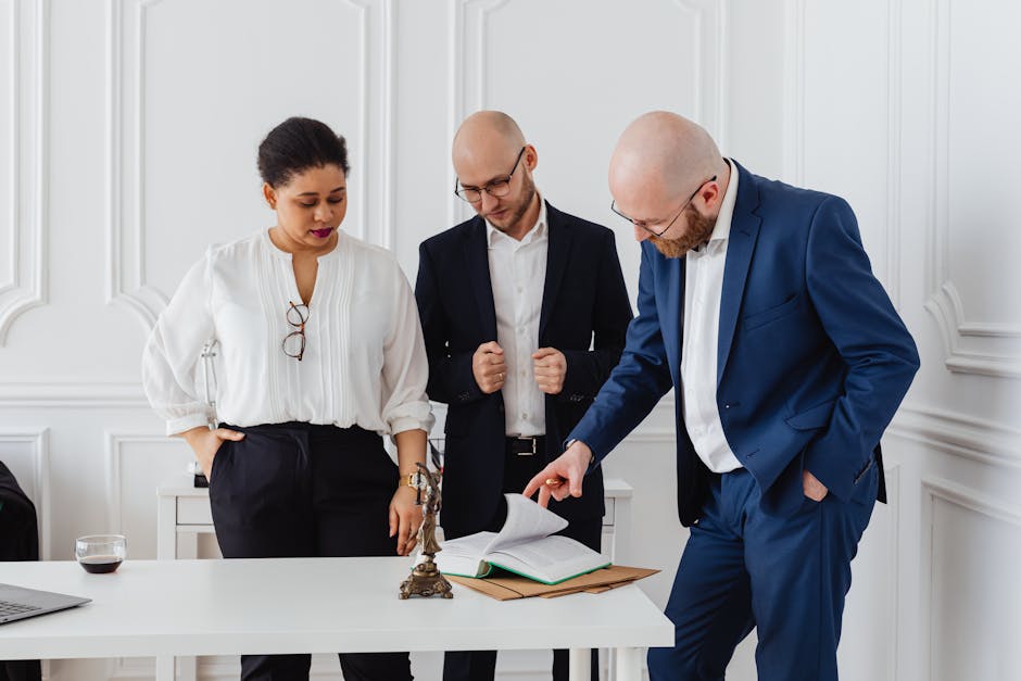 Diverse team of professionals analyzing documents - representing comprehensive hiring guidance