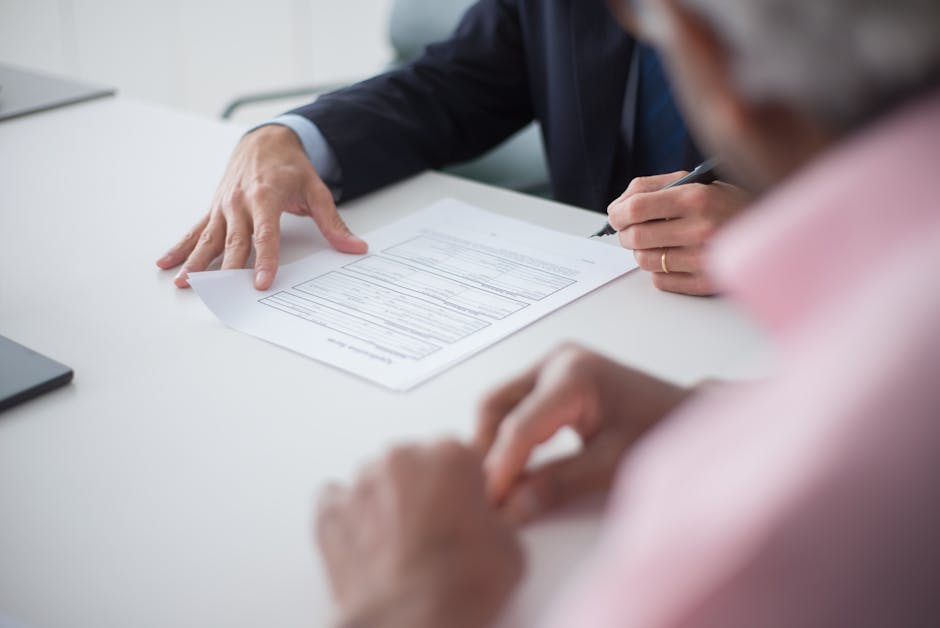 Two professionals engaging in a business meeting, signing documents for a consulting agreement - representing client communication excellence